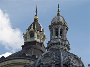 Two church towers with architectural details in front of a blue sky, Historical buildings, Antwerp,