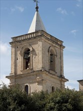 Historic stone bell tower rises against a blue sky, Valetta, Malta, Europe