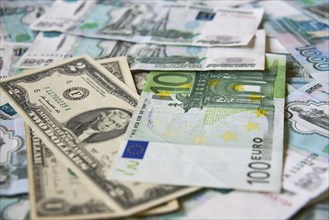 Background of paper bills dollars, euros and rubles. Currency exchange rate
