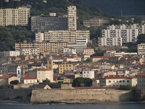 City scene with many buildings on the hillside along the coast, Corsica, ajaccio, France, Europe