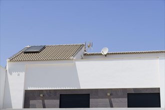 Roof of a house installing solar panels with a blue sky background