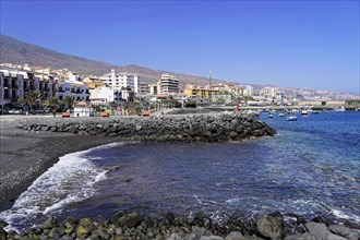 Black volcanic beach in Candelaria, Tenerife, Canary Islands, Spain, Europe, town on the coast with