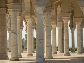 White columns and arches in historic Mediterranean architecture in the sunshine, Tunis in Africa