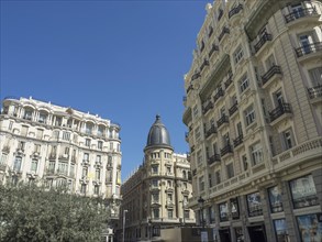Bright historic buildings in an urban setting on a sunny day under blue skies, Madrid, Spain,
