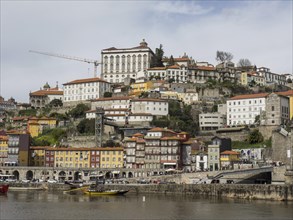 View of the old town on a hill with many historic buildings near the riverside, the old town