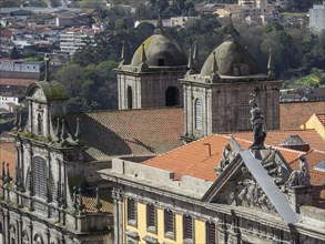 Close-up view of historic buildings with towers, detailed architectural elements and sculptures on