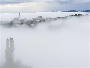 Church rises out of the morning mist, Frauenberg pilgrimage church, near Leibnitz, Styria, Austria,