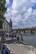 Danube promenade, behind the bridge tower museum with the Stone Bridge, Regensburg, Upper