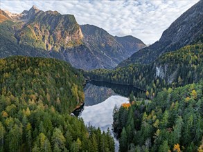 Aerial view, mountain peaks of the Oetztal Alps reflected in Lake Piburger See, in autumn, near