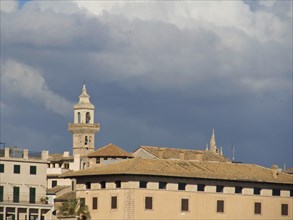 City view with church tower and clouds in the sky, palma de Majorca on the Mediterranean Sea with