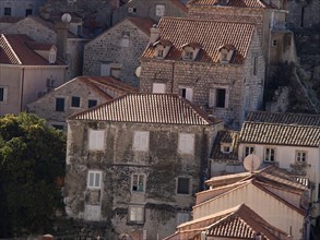 Historic houses with red tiled roofs and shutters show a timeless beauty, the old town of Dubrovnik