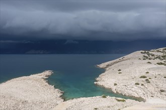 Stormy atmosphere and dark clouds on the coast, island of Pag, Zadar, Dalmatia, Croatia, Europe