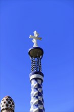 Cross and patterned tower on a blue sky, Barcelona, Catalonia, Spain, Europe
