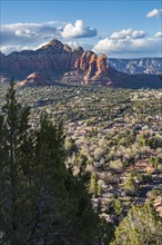 The town of Sedona, Arizona in a valley surrounded by red rock limestone formations, United States