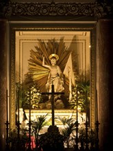 Magnificently decorated altar with statue of a saint and golden rays, palermo in sicily with an