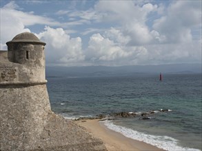 Old fortress on sandy beach with sea view, clouds in the sky, Corsica, ajaccio, France, Europe