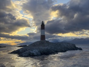 Lighthouse Faro Les Eclaireurs at sunset, dramatic clouds, Beagle Channel, Tierra del Fuego, Tierra