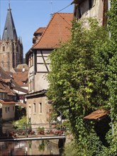 Historic half-timbered houses with floral decorations in Alsace, Wissembourg, France, Europe