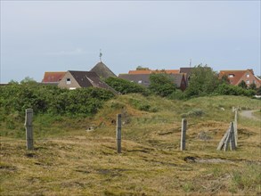 Summer landscape with village and fence, Baltrum Germany