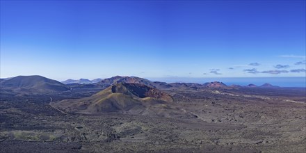 Panorama from the crater rim of Caldera Blanca to the fire mountains in the Parque National de