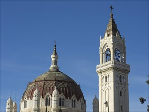 Historic church complex with dome and bell tower in front of a clear blue sky, Madrid, Spain,