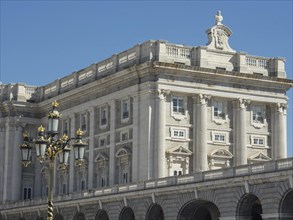 Historic building with many columns and decorations under a clear sky, Madrid, Spain, Europe