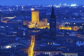 View of the illuminated Castelvecchio castle and the church of San Lorenzo, Verona, Veneto, Italy,