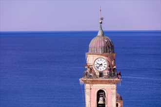 Workers at the top of Church of Santa Maria Assunta, Camogli, Liguaia, Italy, Europe