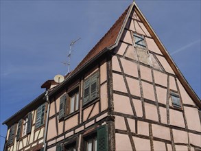 Historic half-timbered houses with floral decorations in Alsace, Wissembourg, France, Europe