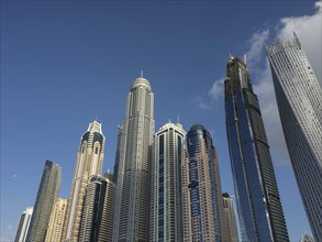 Group of imposing skyscrapers in front of a clear blue sky, Dubai, Arab Emirates