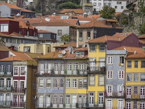 Close-up of colourful houses with many balconies and red roofs, The old town of Porto on the Douro