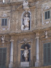 Close-up of an ancient facade with sculptures and reliefs, palermo in sicily with an impressive