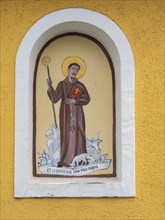 Image of a figure of a saint, fresco on a wayside cross, near St.Andrae-Hoech, Sausaler Weinland,