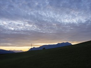 Sunset over mountain peaks, Eisenerz Alps, view from the lowlands, Leoben, Styria, Austria, Europe