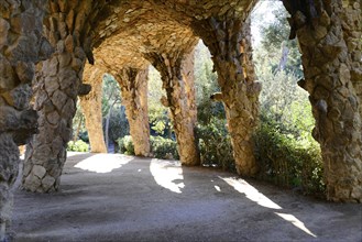 Park Gueell, Barcelona, Catalonia, Spain, Europe, Light and shadow under stone arches in a park,