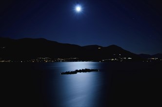 Aerial View with Moon Light Reflected over an Alpine Lake Maggiore with Brissago Islands and