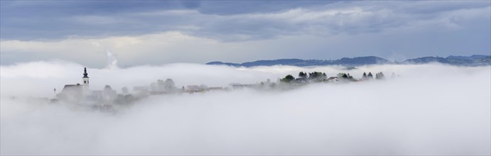 Church rises out of the morning mist, Frauenberg pilgrimage church, panoramic view, near Leibnitz,