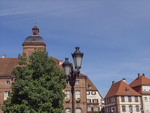 Historic half-timbered houses with floral decorations in Alsace, Wissembourg, France, Europe