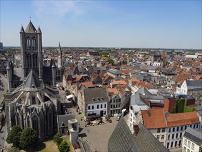 Aerial view of an old city centre with a central cathedral surrounded by historic buildings and