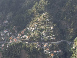 Aerial view of a mountain village with winding streets and houses, Funchal, portugal