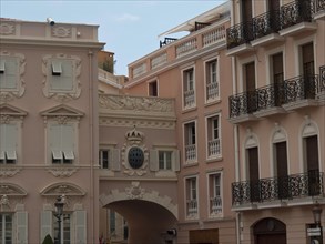 Pink building with ornaments and balconies in an urban environment, Monte Carlo, Monaco, Europe