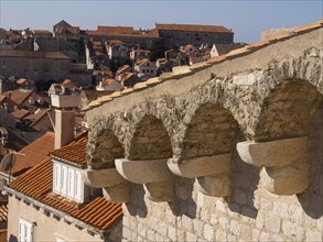 View over the rooftops of a historic old town with medieval features and Mediterranean charm, the