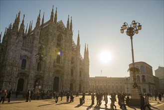 Milan Cathedral in City Square in Sunset with People in Milan, Lombardy, Italy, Europe