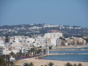 Urban landscape with mountains in the background and the sea in the foreground, Tunis in Africa