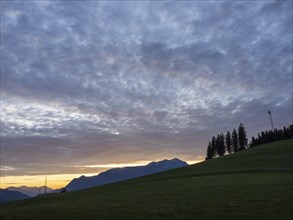 Sunset over mountain peaks, Eisenerz Alps, view from the lowlands, Leoben, Styria, Austria, Europe