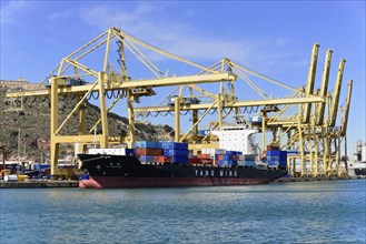 Container port and ships, Barcelona, Spain, Europe, Large cranes and loaded container ship in the