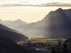 Sunlight falls on the Liesingtal valley and the village of Traboch, Schoberpass federal road, view