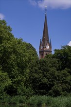View from Johannapark to Heilig-Kreuz-Kirche, church tower, Leipzig, Saxony, Germany, Europe