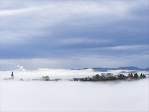 Church rises out of the morning mist, Frauenberg pilgrimage church, panoramic view, near Leibnitz,