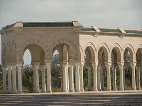 Sandstone arcades with arches and columns in open daylight, Tunis in Africa with ruins from Roman